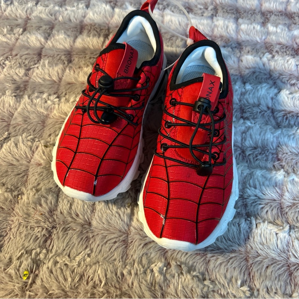 Red and Black Sneakers with Breathable Mesh and Sleek Design